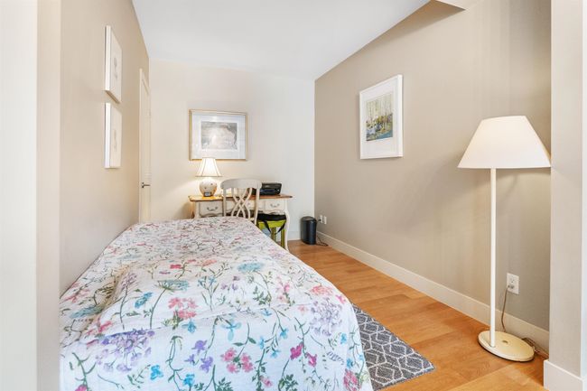 Bedroom with wood finished floors and baseboards | Image 14