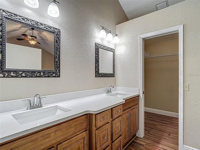 Primary double vanities with new quartz countertop. A walk-in closet. | Image 27