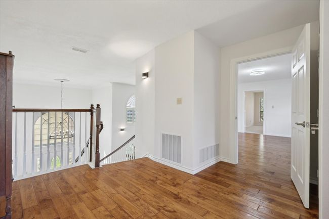 Hall featuring an upstairs landing and wood-type flooring | Image 28