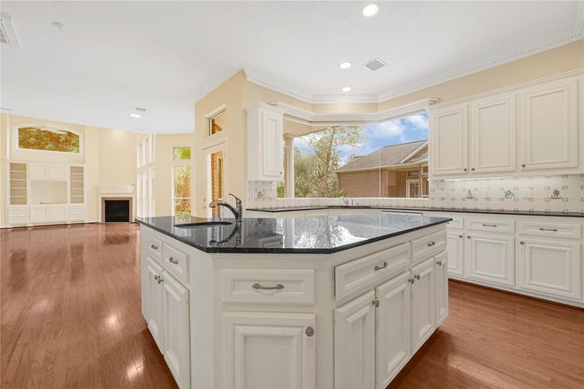 Enjoy stunning patio views from the spacious kitchen island. | Image 19