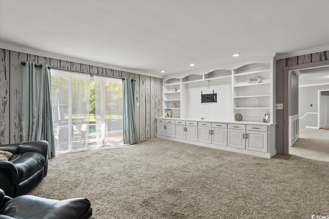 Living area featuring crown molding, carpet floors, and recessed lighting | Image 12