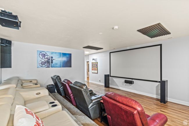 Home theater room featuring wood-type flooring | Image 60