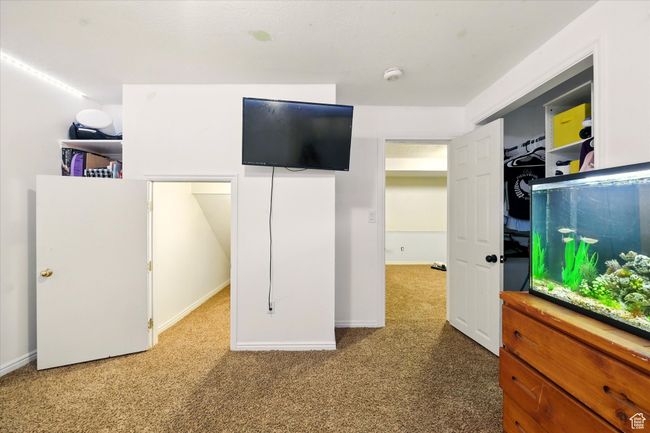 Carpeted bedroom featuring baseboards | Image 20
