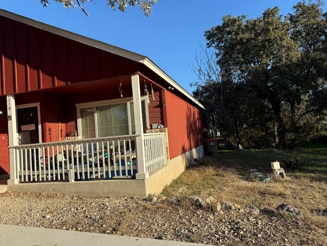 View of side of property with nice cover porch. | Image 29