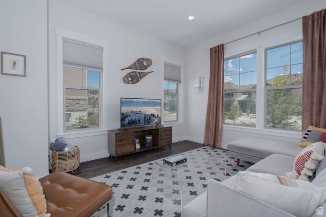 Living room featuring plenty of natural light, baseboards, recessed lighting, and wood finished floors | Image 5