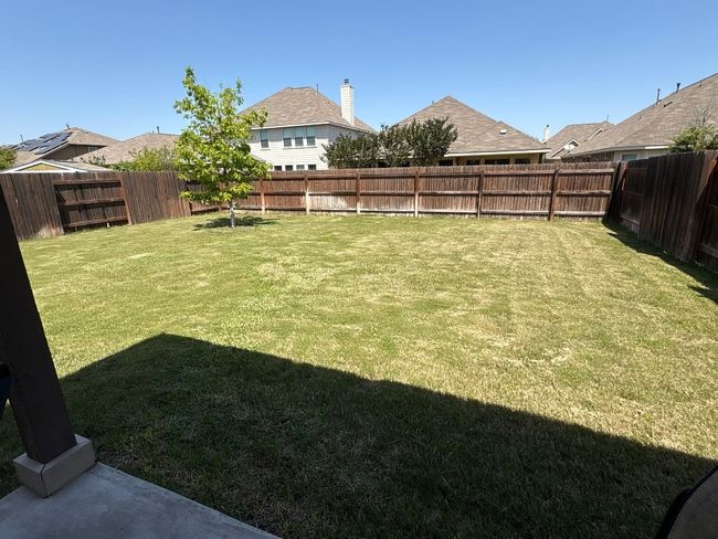 View of yard with a fenced backyard | Image 39