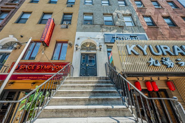 View of building exterior featuring entry steps | Image 22