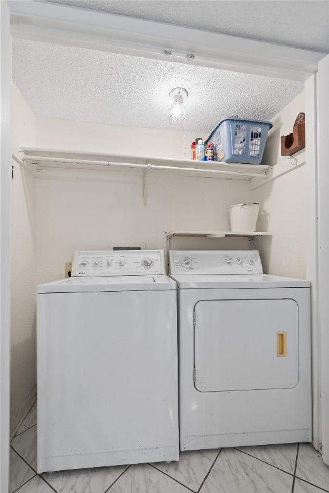 Washroom with independent washer and dryer, laundry area, and marble finish floor | Image 33
