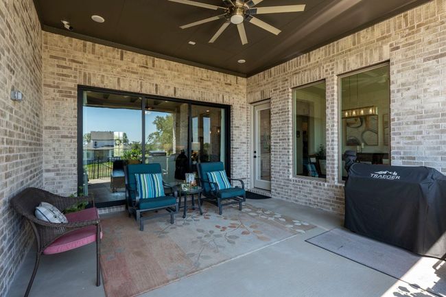 View of patio featuring a ceiling fan and area for grilling | Image 29