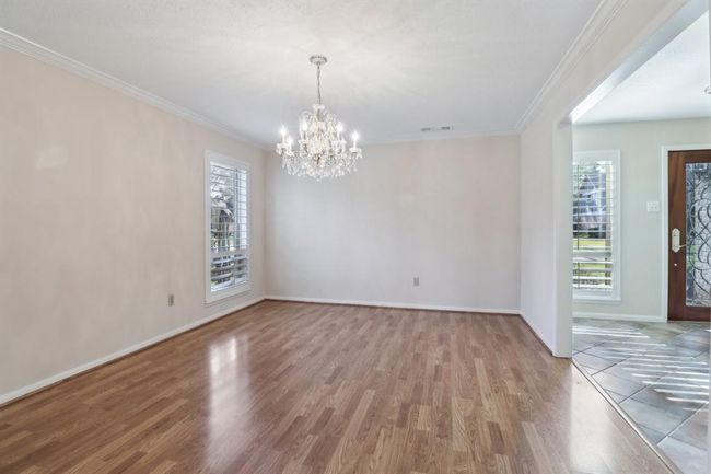 Formal dining room with wood flooring | Image 15