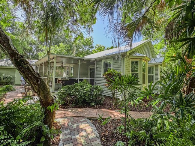 View of screened lanai and metal roof | Image 22