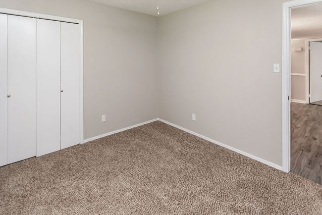 Unfurnished bedroom featuring carpet floors, a closet, and ceiling fan | Image 29