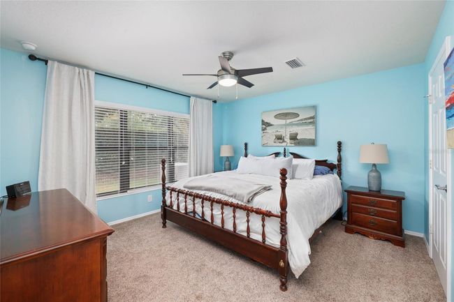 Spacious primary suite offers comfort, privacy, and a peaceful retreat. | Image 11