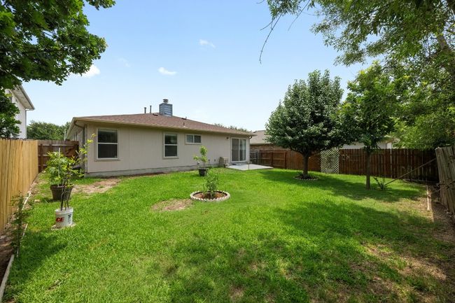 Rear view of house featuring a chimney | Image 27