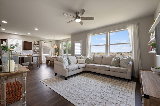 Living area featuring a ceiling fan, recessed lighting, and luxury vinyl flooring. | Image 5