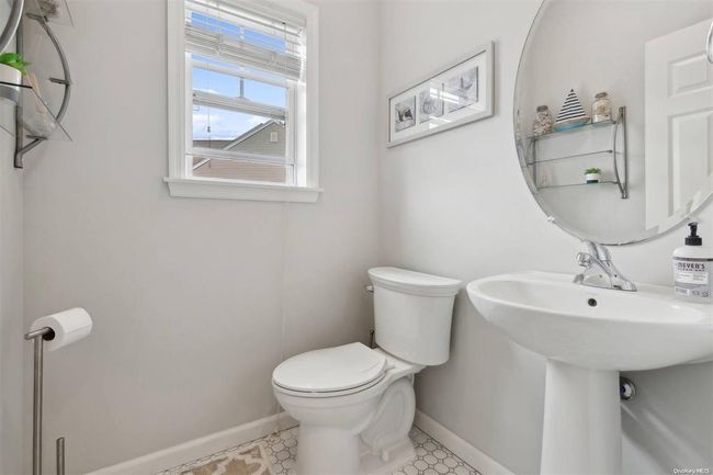 Bathroom with toilet and baseboards | Image 10