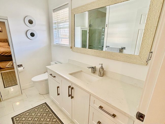 Ensuite bathroom with vanity and a shower stall | Image 18