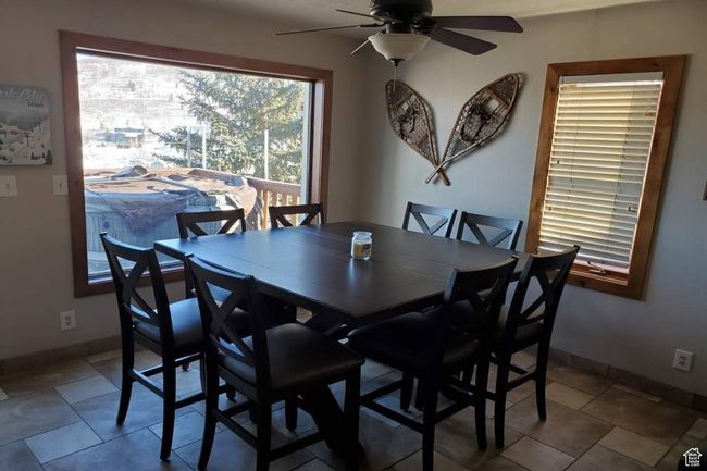 Tiled dining area with ceiling fan | Image 6