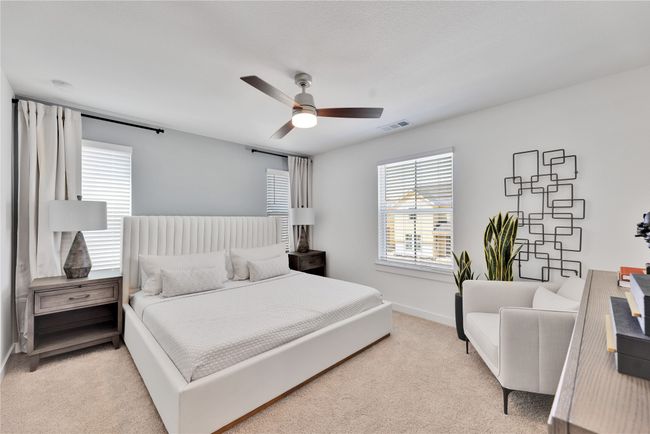 Bedroom with visible vents, baseboards, a ceiling fan, and light colored carpet | Image 16