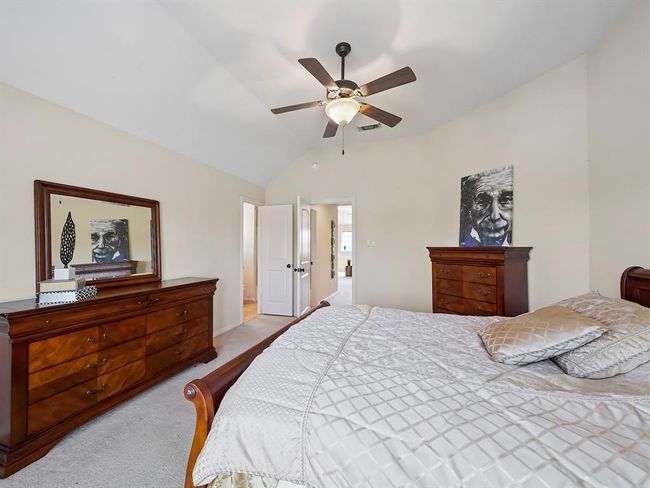 Experience serene lake views from the second-floor bedroom's balcony, complete with an ensuite bathroom. | Image 39