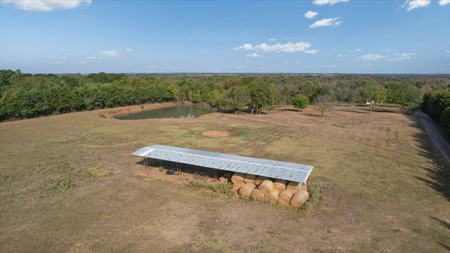 Birds eye view of property with a rural view and a water view | Image 8