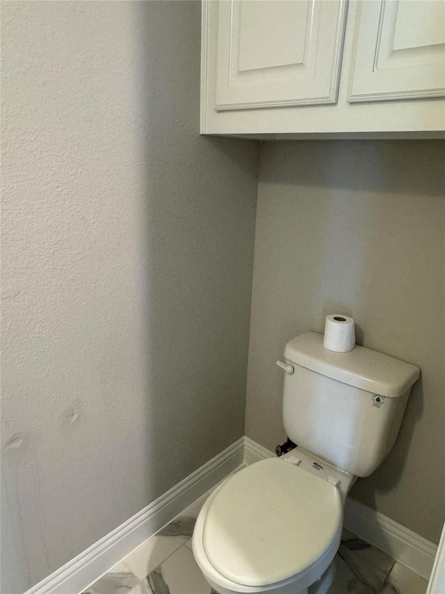 Bathroom with marble finish flooring and baseboards | Image 19