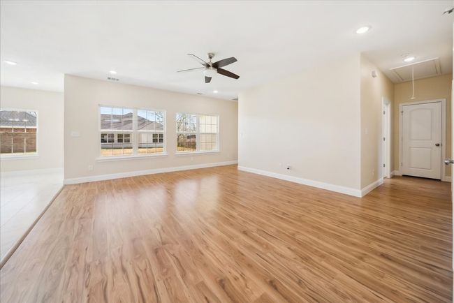Unfurnished living room featuring ceiling fan and light hardwood / wood-style flooring | Image 5