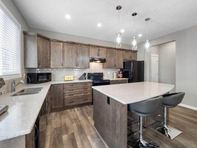 12 Yorkstone Heath Sw, Home with 4 bedrooms, 2 bathrooms and 4 parking in Calgary AB | Image 8