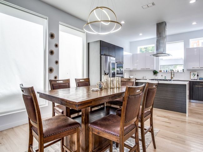 Dining room featuring light wood-type flooring, recessed lighting, and a chandelier | Image 7