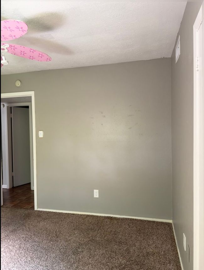 Spare room with carpet flooring, a smoke detector, and a textured ceiling | Image 16