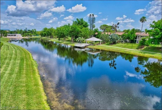 Peaceful views of lake. Boardwalk around property. | Image 3