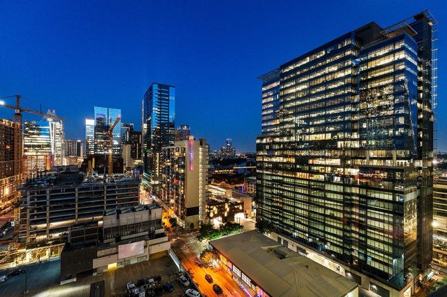 View of city featuring a view of city lights from balcony | Image 28