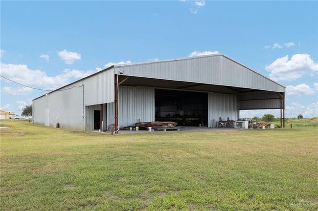 View of outdoor structure featuring a yard | Image 23