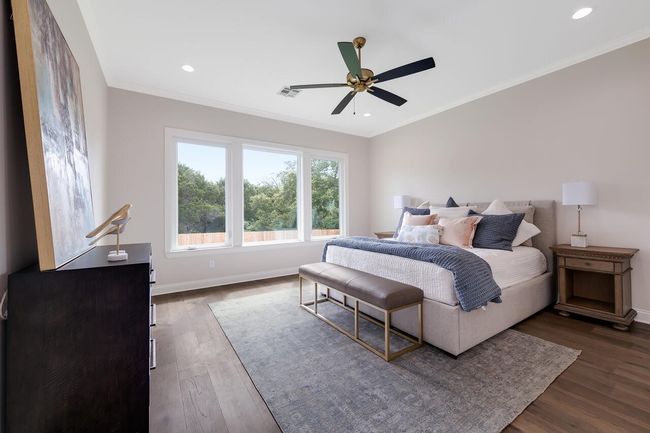 Bedroom featuring dark wood-style flooring, crown molding, recessed lighting, and a ceiling fan | Image 26