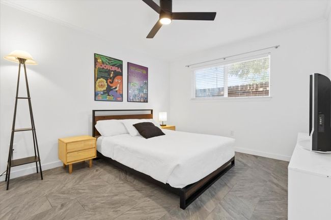 Bedroom featuring baseboards and a ceiling fan | Image 13