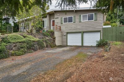 Front of home with two car garage and plenty of parking. | Image 1