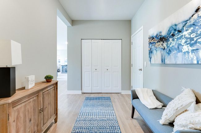 Another view of the mudroom space, which (like the rest of the main level) is wide open and features both a large coat closet and powder room bath! Photo of model home, color and options will vary. | Image 20