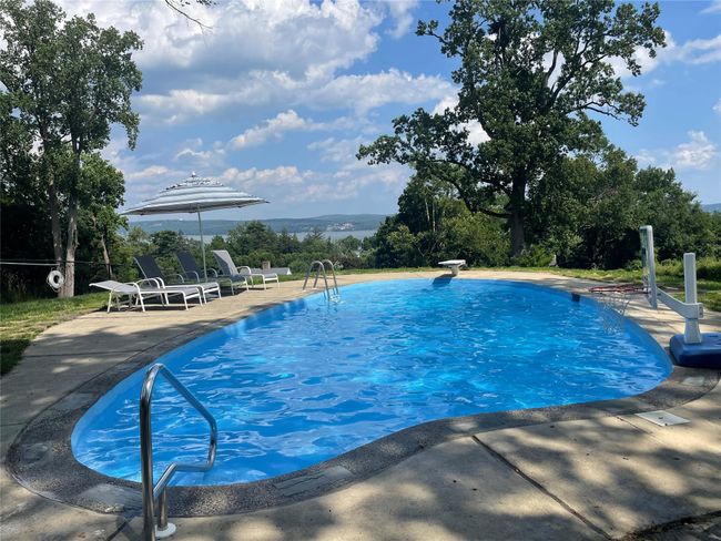 Swimming pool with a patio area | Image 24