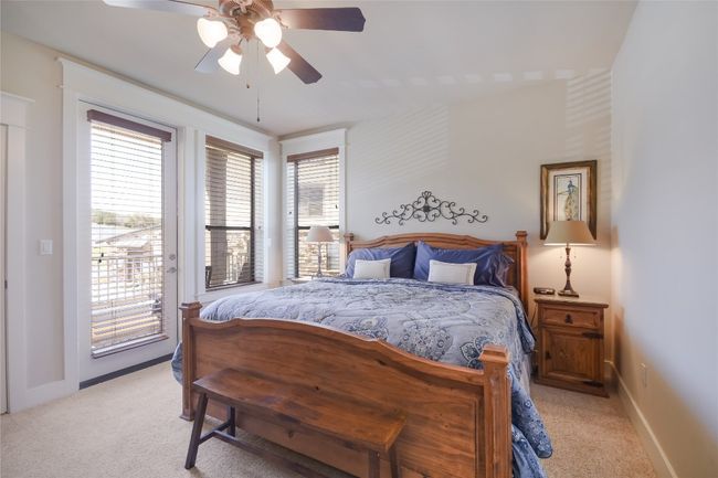 Primary Bedroom with private patio access and en suite bath | Image 11