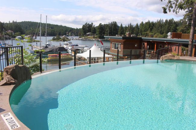 View of pool featuring a view of trees and a water view | Image 33