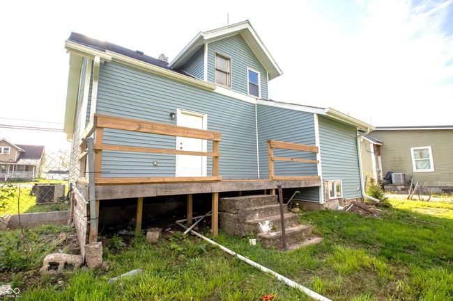 back of house featuring central air condition unit, fence, and a deck | Image 5