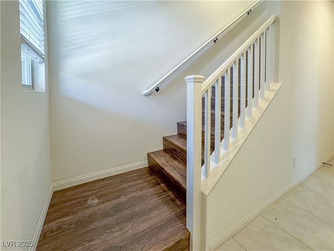 Staircase with baseboards and wood finished floors | Image 6