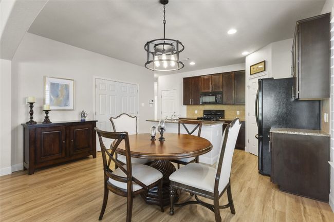 Dining area with beautiful new light fixtures | Image 6