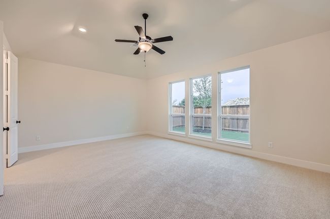 Spare room with baseboards, light colored carpet, recessed lighting, and a ceiling fan | Image 15