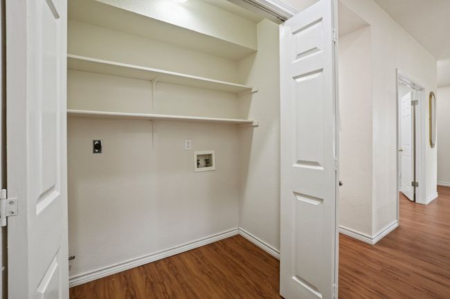Conveniently located in the hallway, the laundry room is easily accessible from all bedrooms. 9349 Bernoulli Dr., Austin, TX 78748 | Image 22