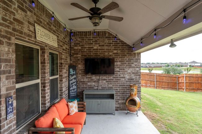 View of patio / terrace featuring a ceiling fan and outdoor lounge area | Image 29