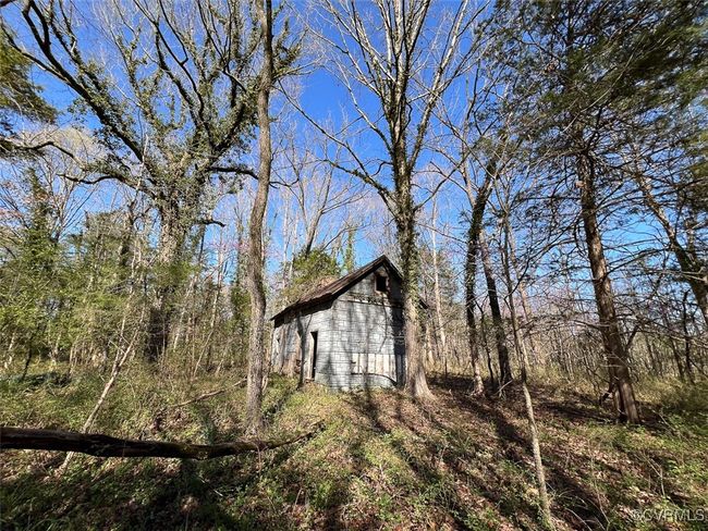 View of home's exterior with an outdoor structure and a barn | Image 13