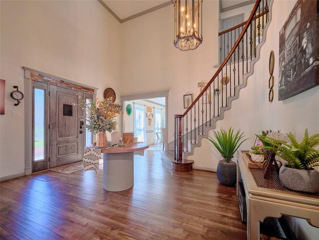 High Ceilings and grand staircase as you step inside. | Image 4