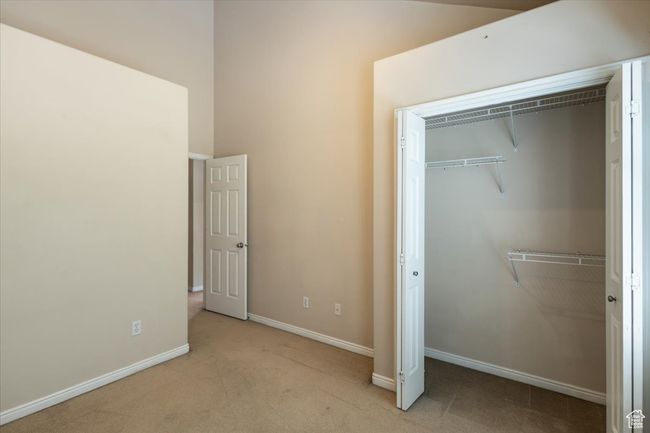 Bedroom with carpet floors and a closet | Image 27