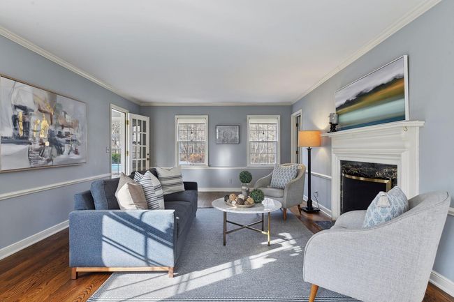 Living room with wood burning fireplace. | Image 7